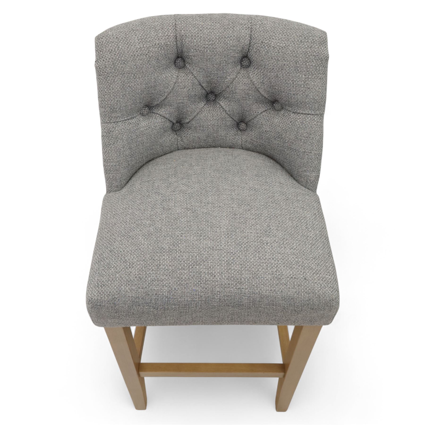 Contemporary set of three upholstered bar stools, each with button-tufted grey fabric backrest and seat, raised on light oak finish square legs united by stretchers