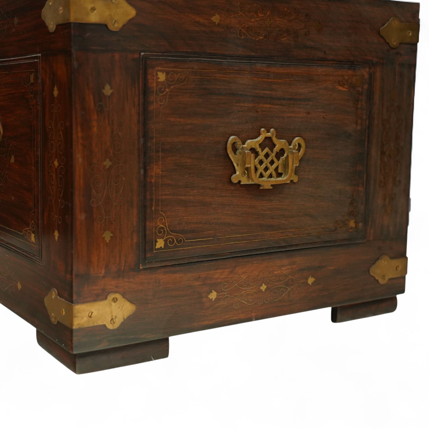 Pair of late 19th century colonial hardwood and brass inlaid chests, each rectangular with hinged top and brass strapping, floral and urn pattern inlay to the panels, with pierced brass side handles, fitted baize-lined butlers tray