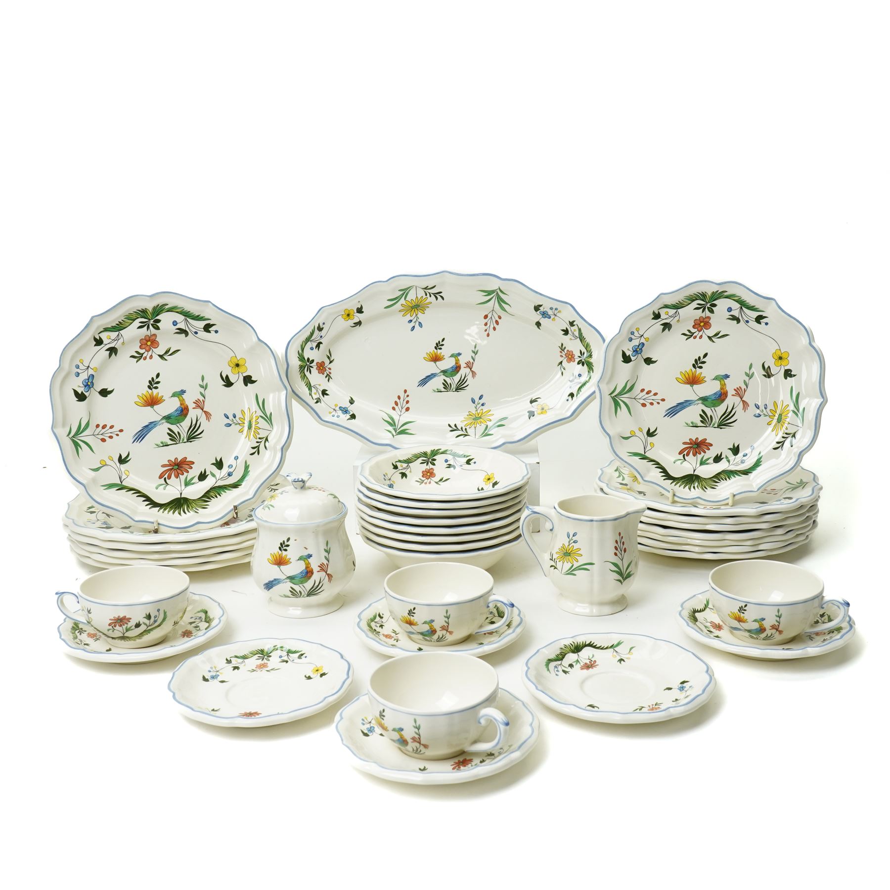Gien France faience tea and dinner service in the 'Oiseaux de Paradis' pattern comprising six dinner plates, eight dessert plates, eight soup bowls, four cups, six saucers, oval plate, milk jug and sugar bowl and cover