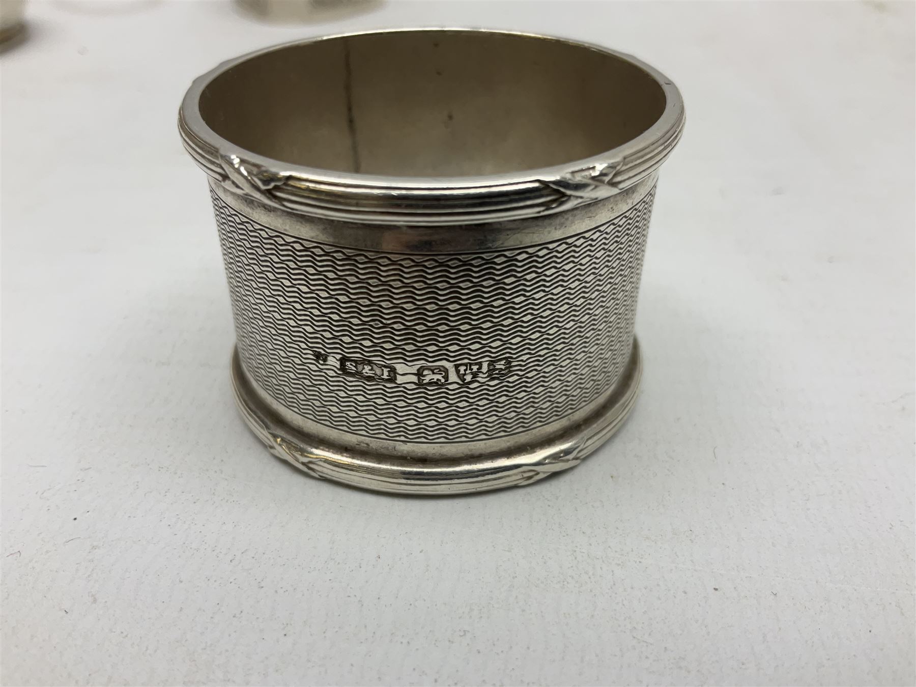 Group of silver to include cased set of six silver handled knives hallmarked Birmingham 1921 by Raeno Silver Plate Co, three hallmarked napkin rings etc together with silver plated and other metalware etc