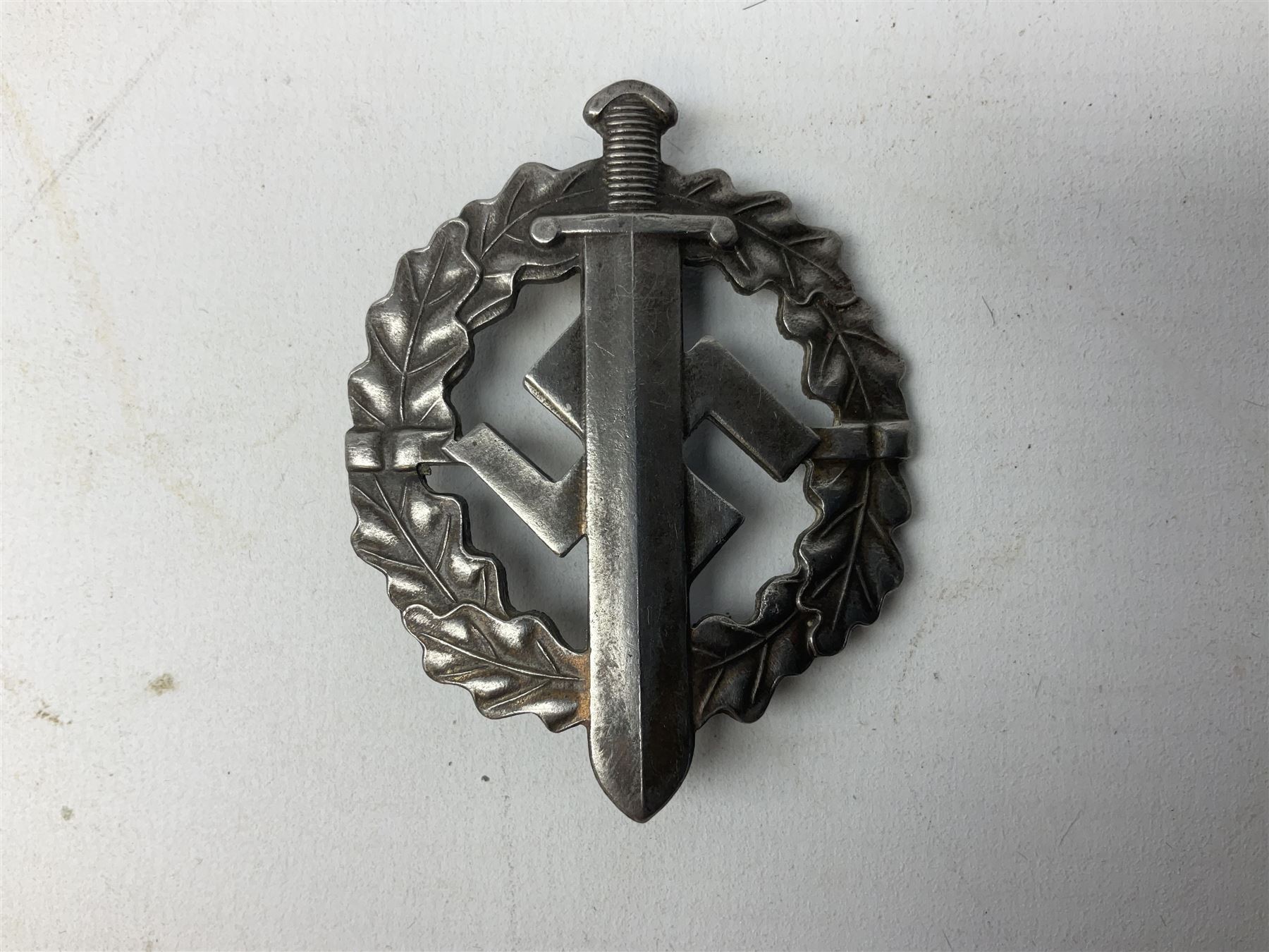 Two WW2 German Sports badges - SA sports badge marked verso 'W.Redo Eigentum D. Obersten SA. Fuhrung Saar Lautern'; and DRL sports badge marked verso 'Wernstein Jena D.R.G.M. 35269' (2)