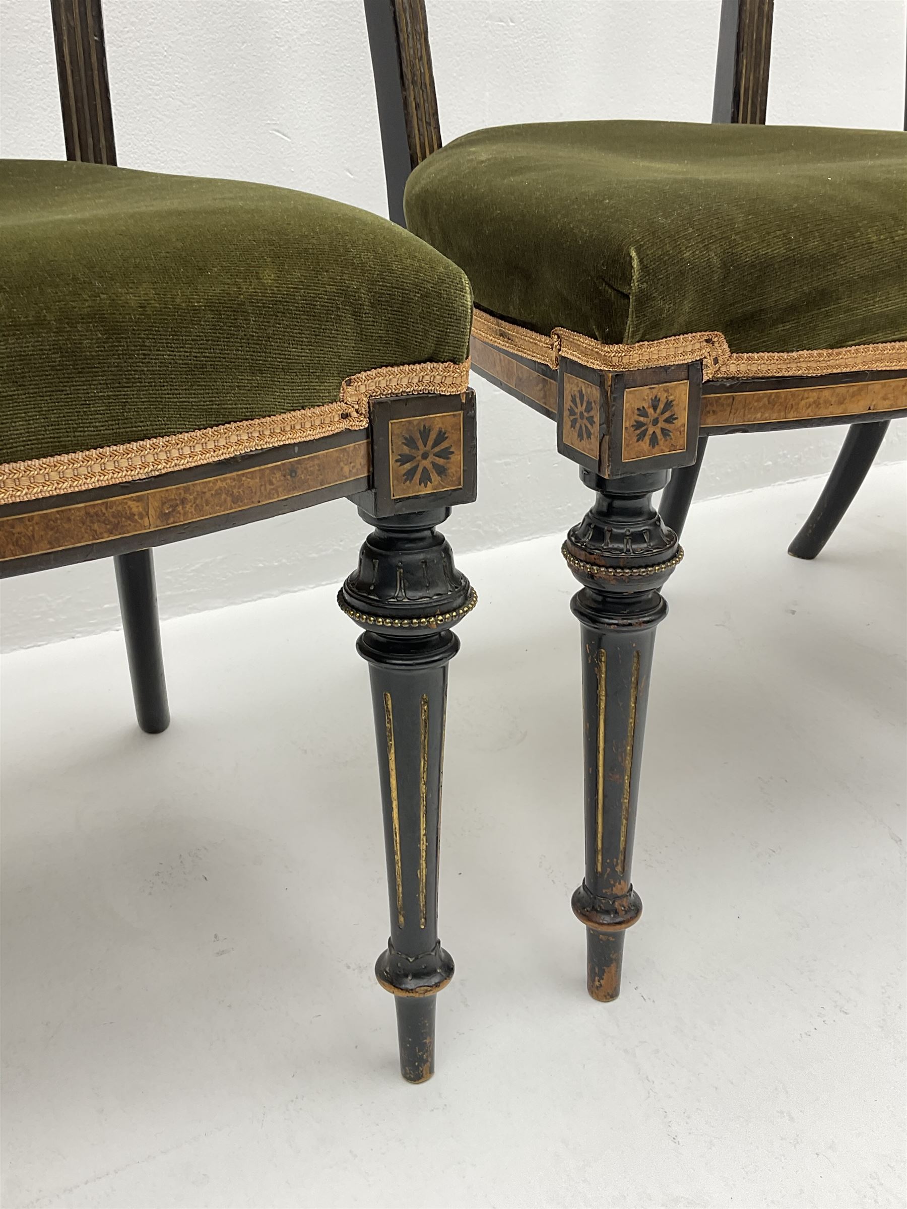Set three late Victorian salon side chairs, ebonised frames inlaid with amboyna wood, with applied brass beading, turned and fluted supports with gilt detail
