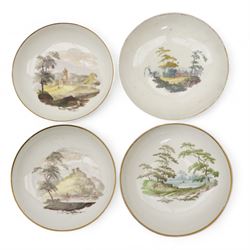 Set of four Pinxton porcelain bute shaped teacups and saucers, circa 1796-1813, pattern no. 218, painted in polychrome with landscape panels within gilt rims, possibly by John Cutts, three pieces numbered 218 beneath, saucer D14cm, teacup H6cm (8)