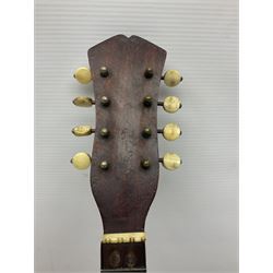 Late 19th century Italian lute back mandolin with segmented bowl back, bears label Gennaro Maglioni Napoli L61cm; in ebonised wooden case; together with another similar damaged Italian lute back mandolin for restoration or spares (2)