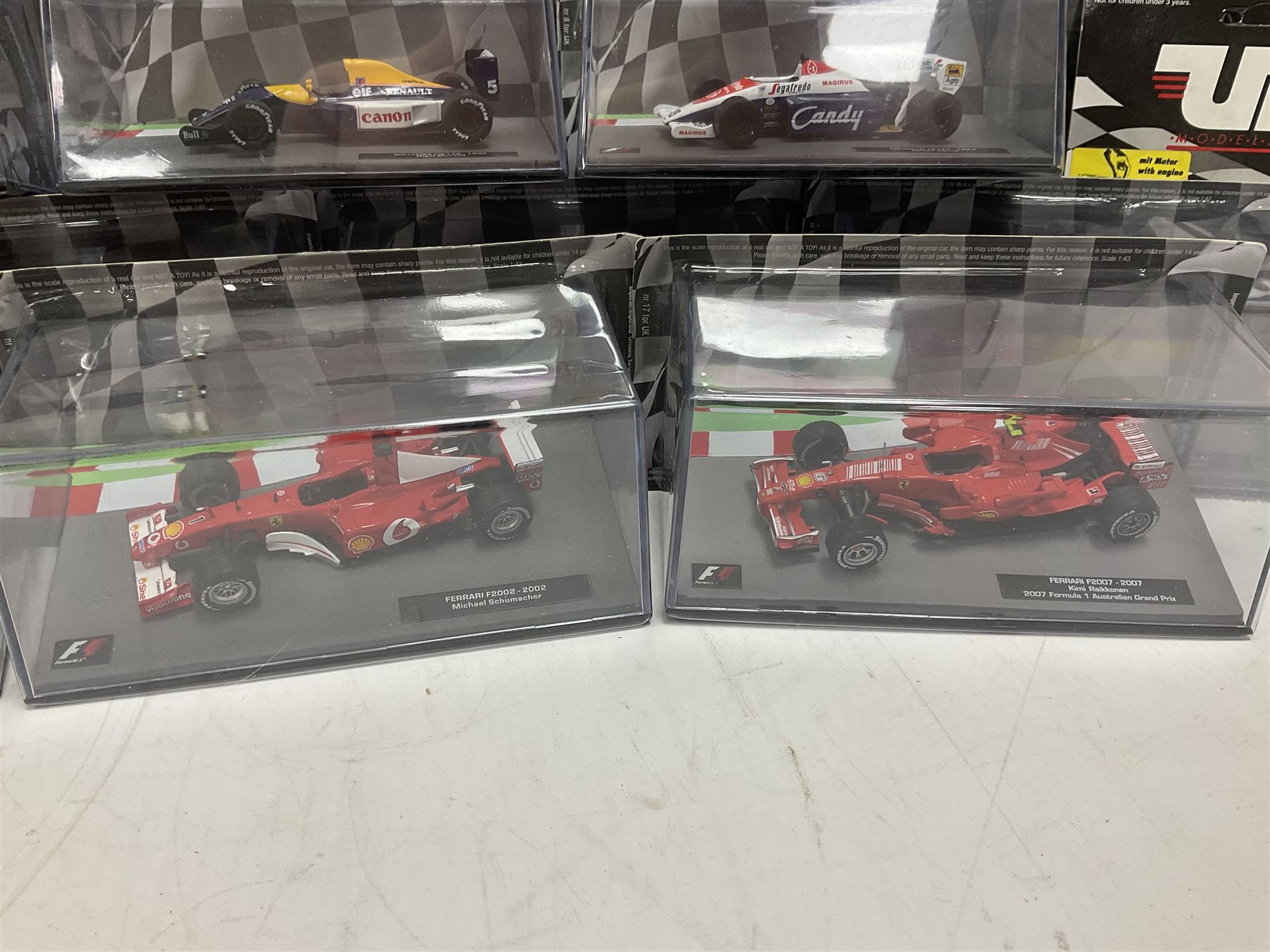 Panini Formula 1 The Car Collection - twelve blister packed racing cars and quantity of periodicals; nine mostly unopened Atlas Editions British Touring Car Champions; and six other boxed/blister packed die-cast models of racing cars