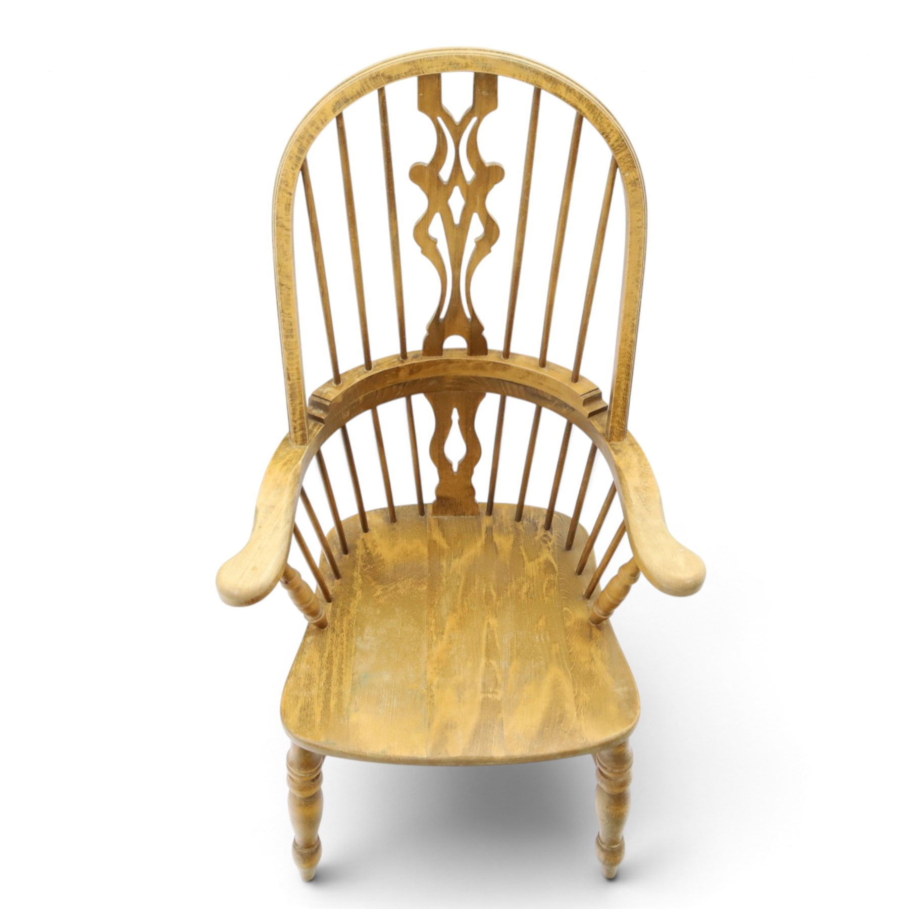 Traditional elm Windsor armchair, hooped spindle back with pierced splat, shaped elm seat, on turned supports united by double H stretcher, turned supports