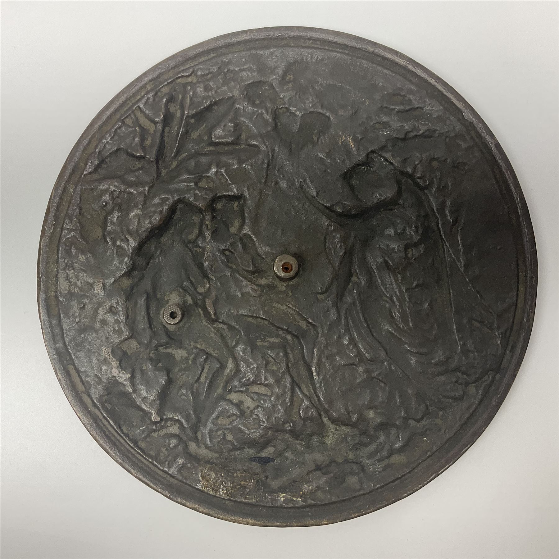 Late 19th century bronze plaque, of circular form, depicting the angel appearing to Adam and Eve in the garden of Eden in high relief, D25.5cm
