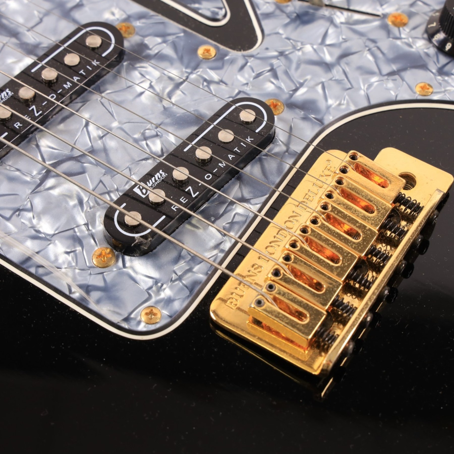 Burns Club Series Marquee electric guitar, serial no. 2070044, circa   early 2000s, black gloss body with marbled metallic blue scratch plate, in a Stagg soft case, guitar L99cm