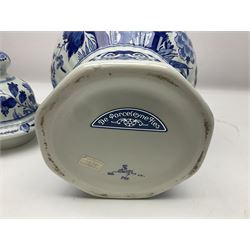 De Porceleyne Fles Delftware blue and white covered jar, of fluted baluster form, with floral and insect decoration, upon an octagonal foot, the octagonal cover with urn shaped finial, H32cm