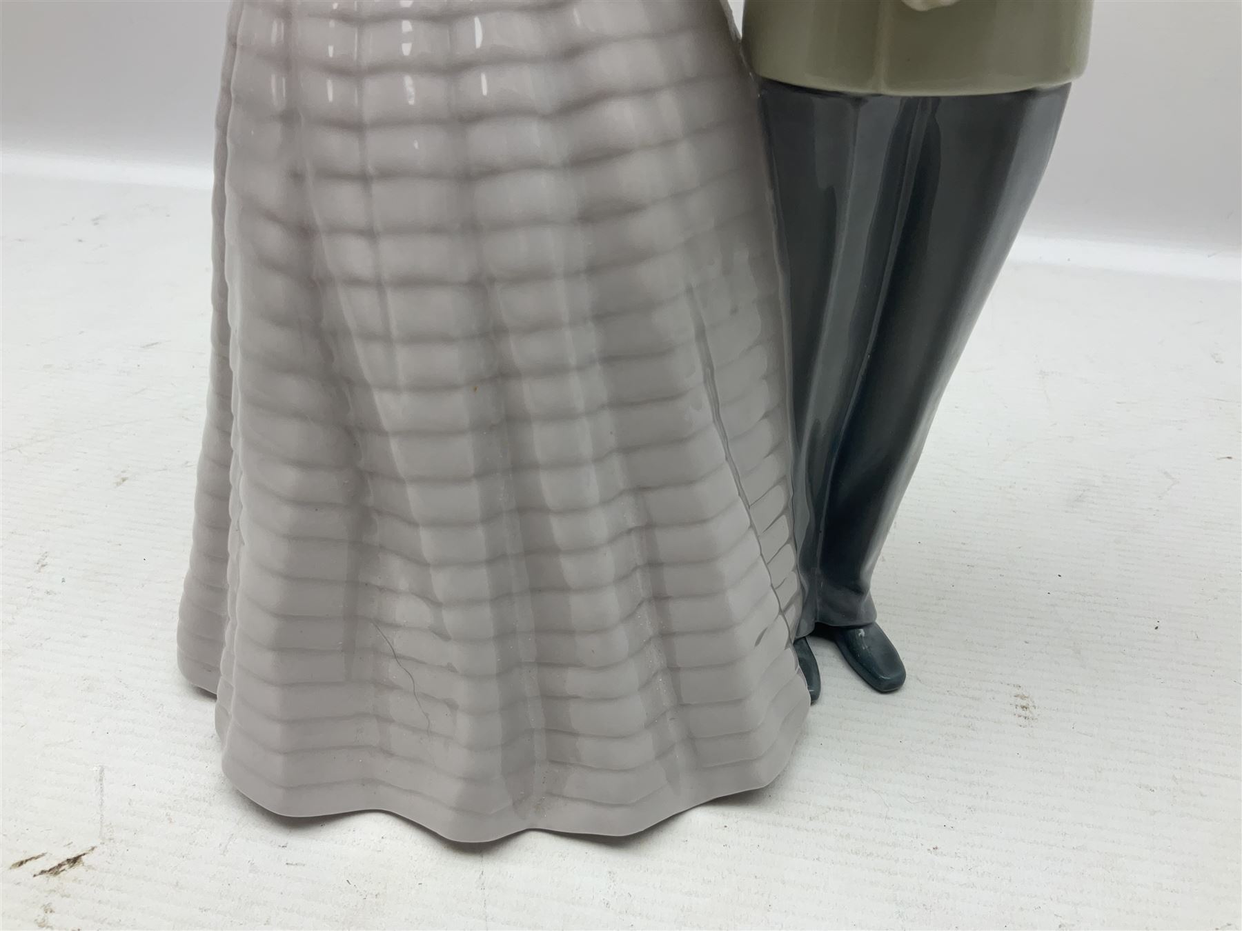 Lladro figure, An Evening Out, modelled as a man and women in evening dress, no 5540, year issued 1988, year retired 1991, H32cm