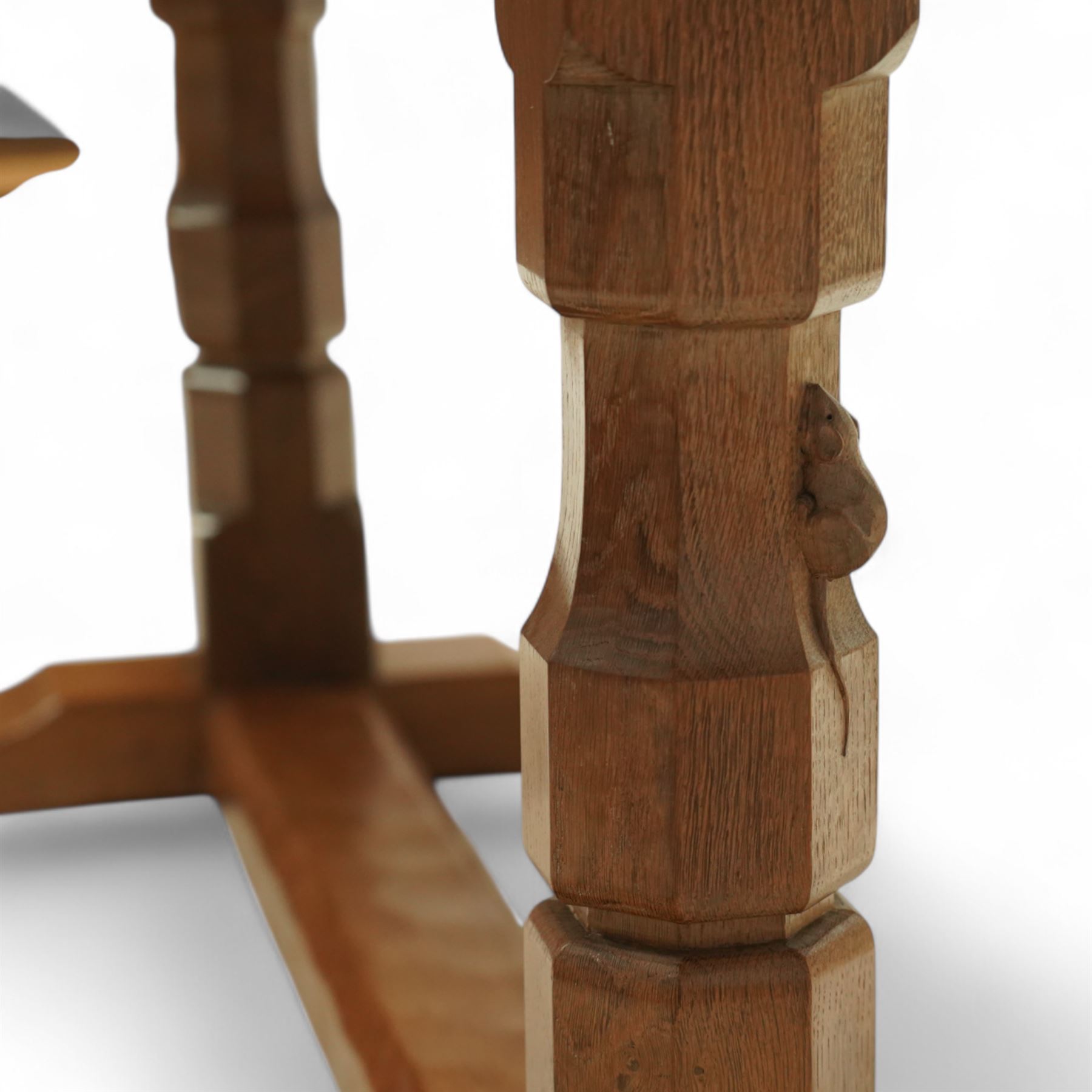 Mouseman - adzed oak 6’ refectory dining table, rectangular top with visible dowel pegs and adzed surface, raised on octagonal carved supports with stretcher and sledge feet, carved mouse signature to leg, by the workshop of Robert Thompson, Kilburn

