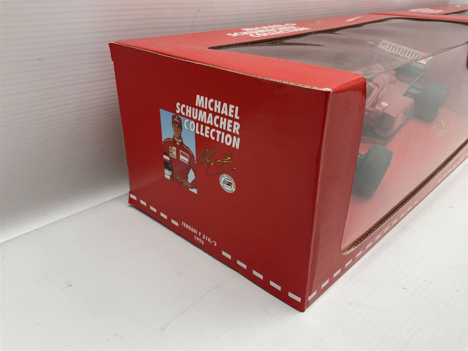 Four Paul's Model Art 1:18 scale Michael Schumacher Collection die-cast racing cars - Ferrari F310B; Ferrari F310/2; Benneton Renault B195; and Ferrari F300; all boxed (4)