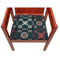 Prince Charles Investiture Chair - designed by Lord Snowdon, manufactured by Remploy, 1969, red finish and decorated with the Prince of Wales's feathers and moto 'Ich Dien' in gilt, later upholstered seat in 1950s design Welsh blanket weave fabric 