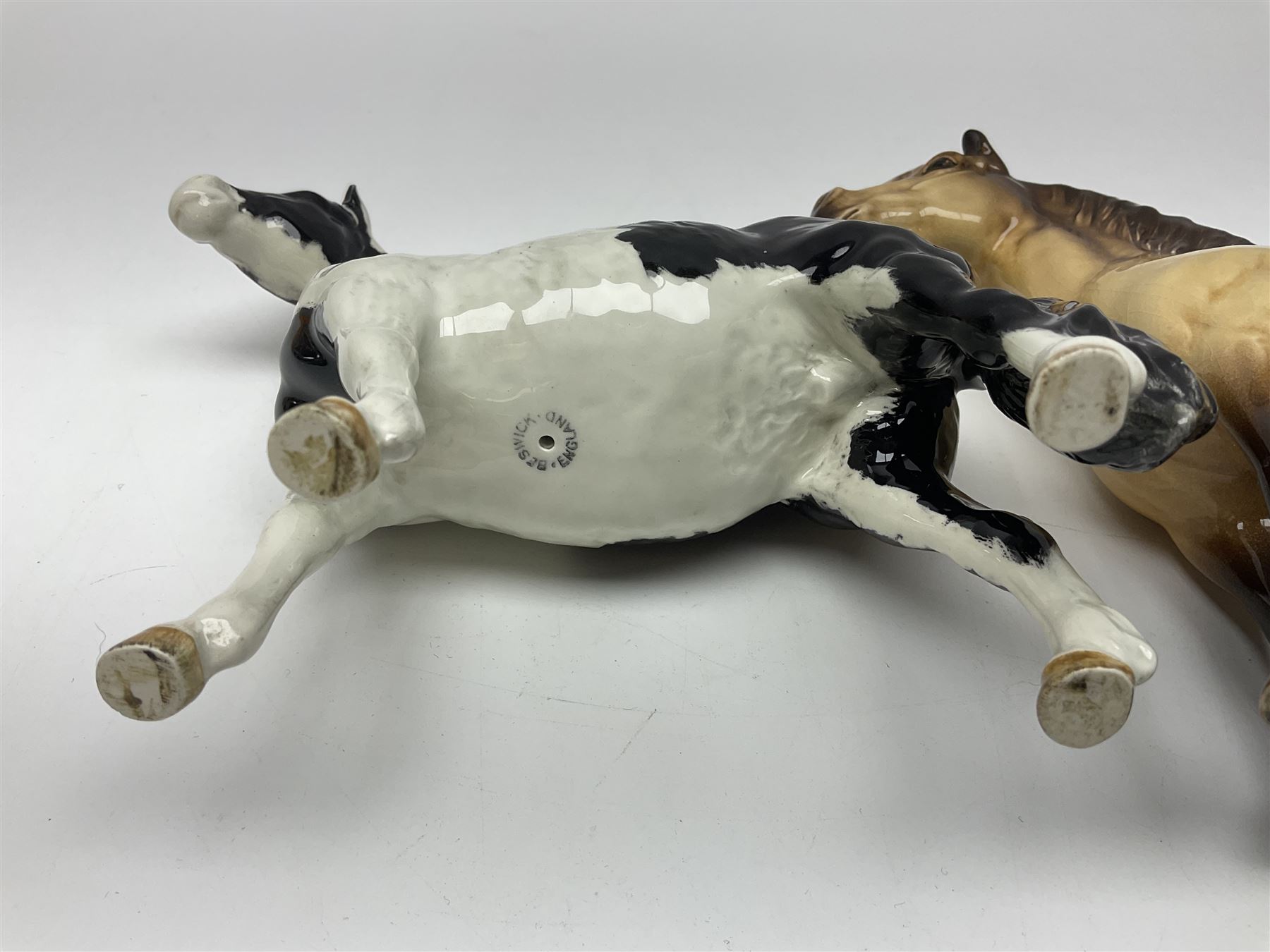 Beswick dun Highland pony no 1644 and piebald Pinto Pony  no 1373, both with printed mark beneath