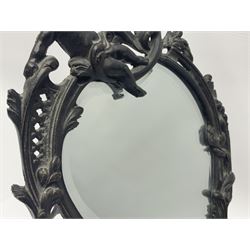 French ornate patinated cast iron picture frame, cast with two central columns, cherubs playing musical instruments and seated winged cherubs within a pierced surround with bird surmount, scroll feet with easel support, inscribed verso 'A.Dyrenne Paris 1882', together with a French Art Nouveau style bronze effect cast iron mirror with bevelled glass plate, stamped Paul Lecourtier, Paris 1878 (2), mirror H41cm, frame H36cm