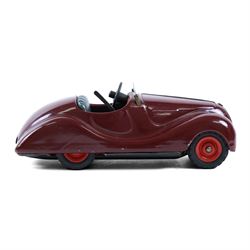 Schuco Akustico 2002 tinplate clockwork car, in burgundy with green metallic interior, with key
