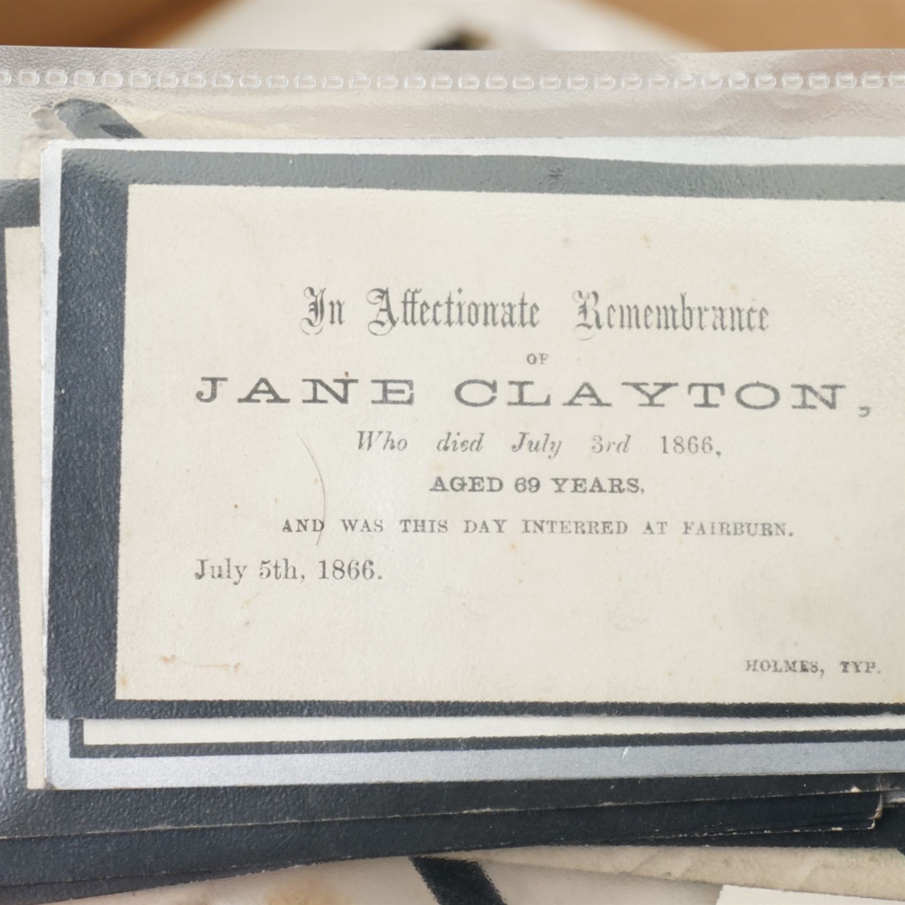 Ephemera including 19th century indenture, Victorian memorial cards and envelopes, sampler by Mary Wilson aged 11, 1940s photographs of George VI and royal family, miniature map of Turin circa 1600 and other items 