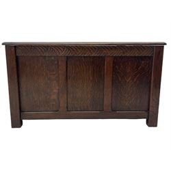 Early 20th century oak blanket box, carved frieze with panelled front