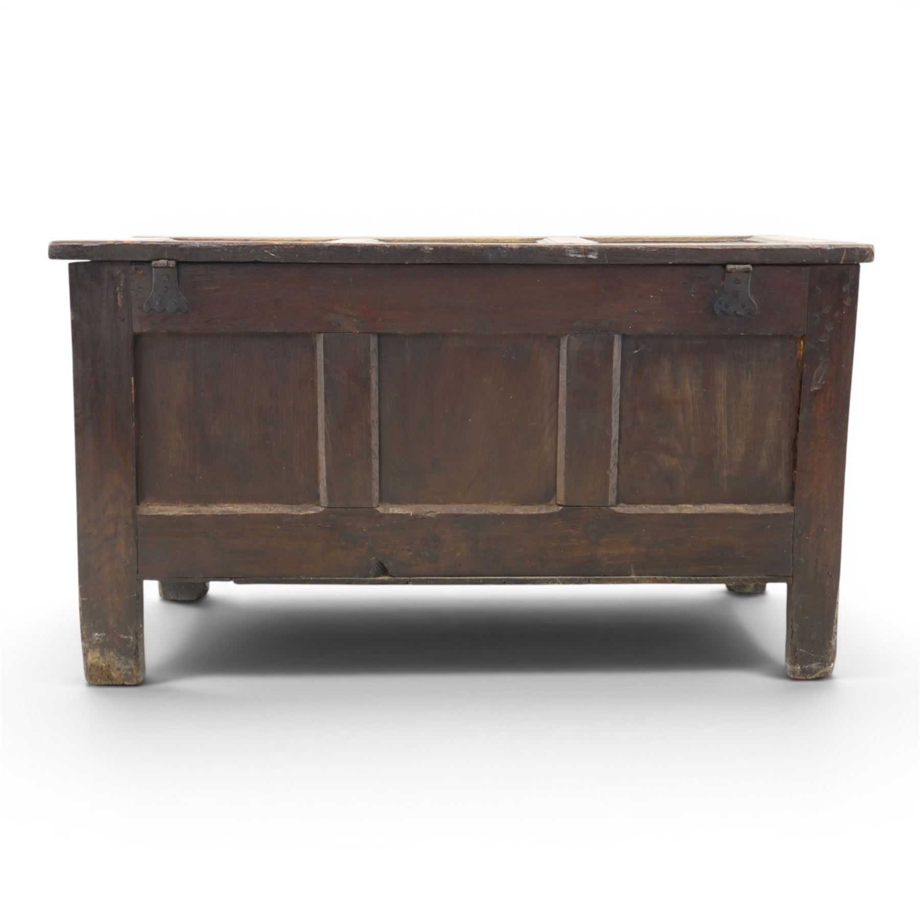 18th century style oak coffer, panelled rectangular top hinged to reveal storage with candle box, carved frieze and front panels, raised on stile feet