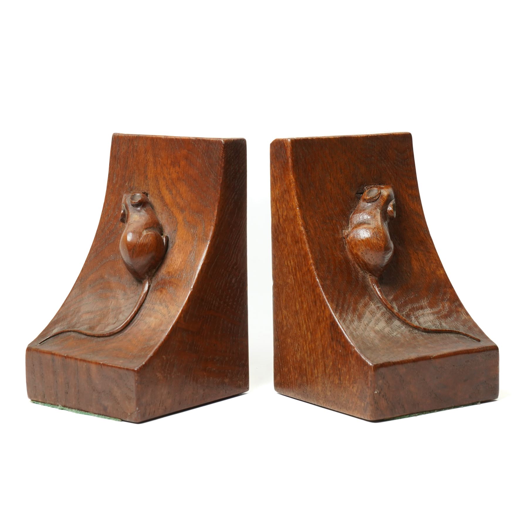 Mouseman - pair of circa 1940s/50s oak bookends, good colour, with carved mouse signatures forming a heart shape when side by side, by Robert Thompson of Kilburn