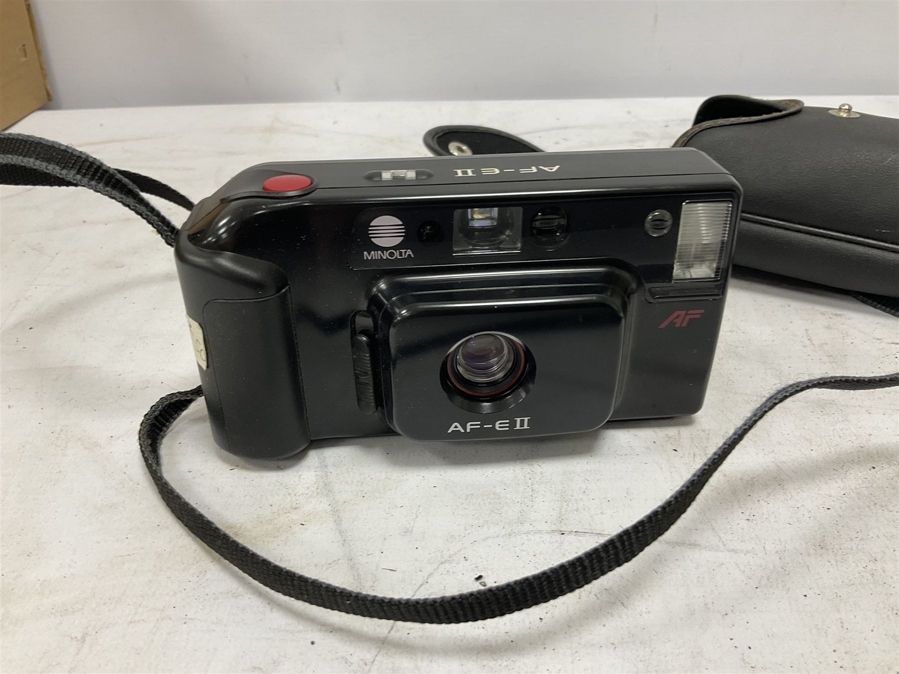 Quantity of cameras and accessories to include Olympus Trip 35, Minolta A f-EII 35mm, Yashica Auto Focus camera, Hanimex 35mm af camera in case, Kodak No.2A Folding Pocket Brownie camera in case, Minolta VLT-501 lens, etc