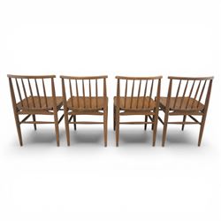 Ensign - Mid-20th century elm extending dining table, with fold out leaf, bow ends and sides; and four low stick back chairs, labelled Ensign Bristow & Townsend Ltd, extended 168cm