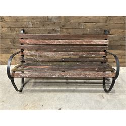 Early 20th century black painted wrought iron and wood slatted garden bench