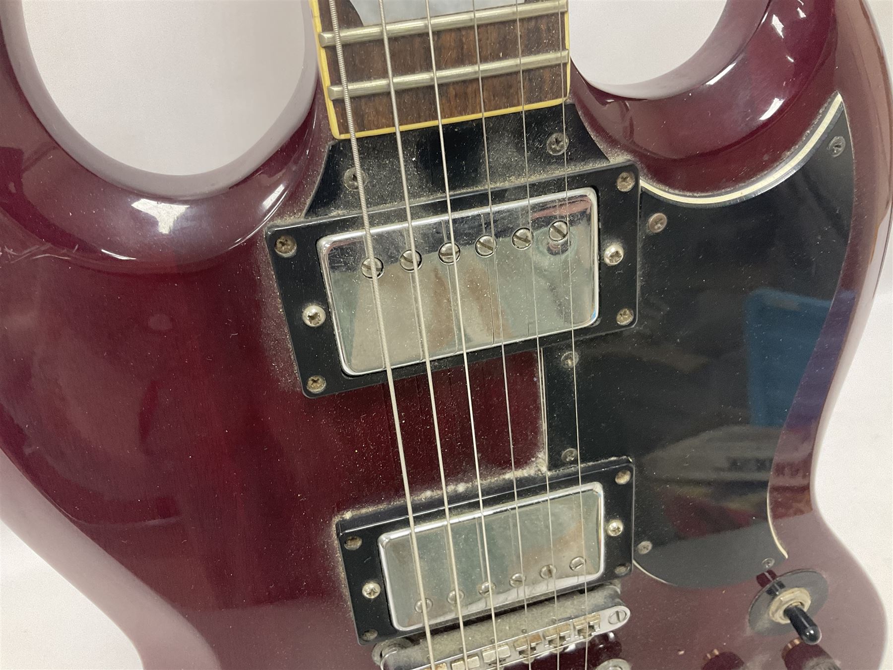 Gibson Epiphone SG six string electric guitar, with cherry red mahogany finish and black scratch guard, L102cm