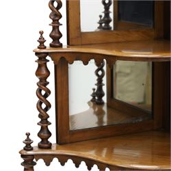 Victorian mahogany five-tier corner whatnot, raised and pierced back of scrolling foliate design, over two tiers with mirror backs and pear-drop moulded aprons, united by pierced spiral-turned uprights, on turned feet