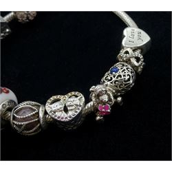 Silver Pandora bracelet with four Disney charms including Minnie Mouse, Simba and Nala from The Lion King, and Tigger from Winnie the Pooh, with eight other silver Pandora charms, in Pandora box