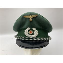 Five reproduction German WW2 hats comprising Wehrmacht olive tropical helmet, Heer officer's peaked cap, two M43 caps and Field side cap (5)