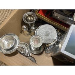 Quantity of metalware to include two hallmarked silver napkin rings (31g), silver plated cutlery sets including a Mappin and Webb example, silver plated oval serving tray with foliate design, candlesticks and other metalware etc, three boxes 