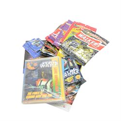 Star Wars collectables and ephemera, including Kelloggs Episode I figures, 1990s Pez Dispensers, Chupa Chups Pop Machine, Stationery, two Tazo Collector's Force Packs, nine KFC buckets and Star Wars related food packaging, inlcuding opened crisp packets and Pepsi cans, etc