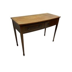 19th century mahogany bow-front side table, fitted with two drawers with satinwood strung facias, raised on square tapering supports with spade feet