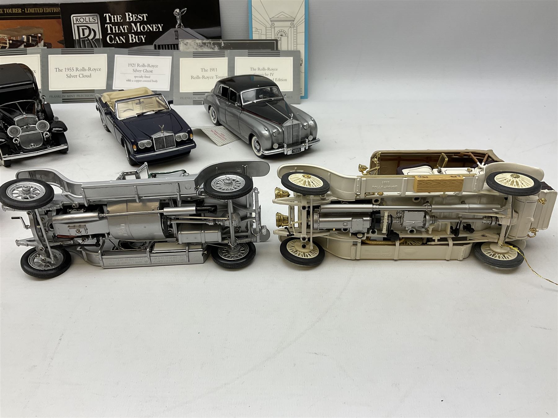 Eight Franklin Mint diecast models of cars, 1911 Rolls-Royce Tourer, The Rolls-Royce Corniche IV, The Mercedes Simplex, 1955 Rolls-Royce Silver Cloud, 1921 Rolls-Royce Silver Ghost, 1907 Rolls-Royce Silver ghost,1929 Rolls-Royce Phantom I,  and 1930 V-16 452 Cadillac Imperial Sedan, all with original tags attached