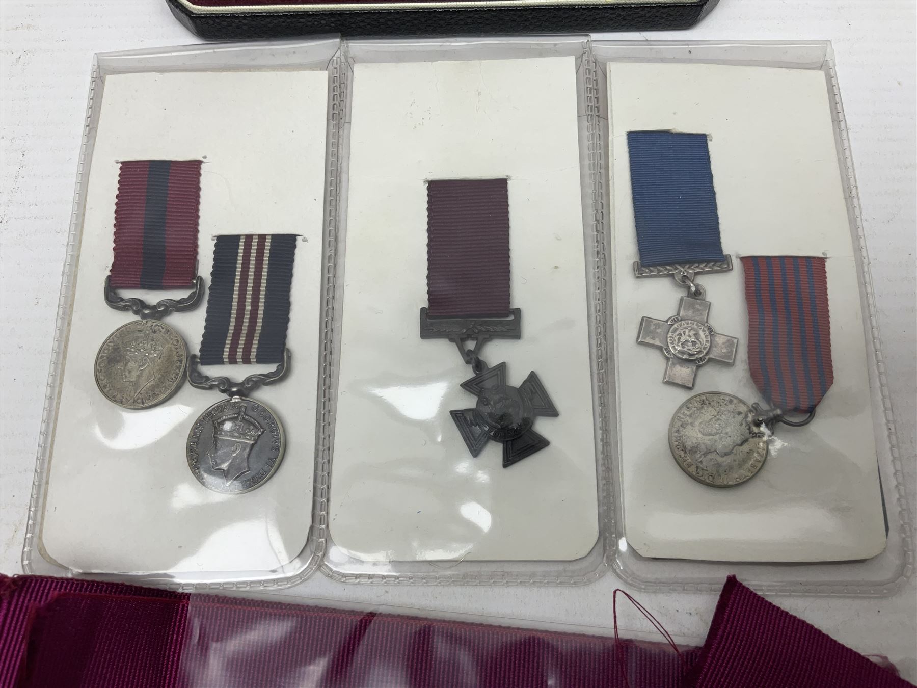 Two Imperial Service Medals to Elsie Hannah Ferguson and Fred Whitehead; each in original case; WWI Special Constabulary Medal to Inspr. Alfred W. Thompson; modern Prisoner of War Medal; cased; replica Victoria Cross and India Mutiny Medals with archive of information relating to Pte. Robert Newell V.C. 9th Lancers; replica Victoria Cross and George Cross with miniatures; and other replica medals etc