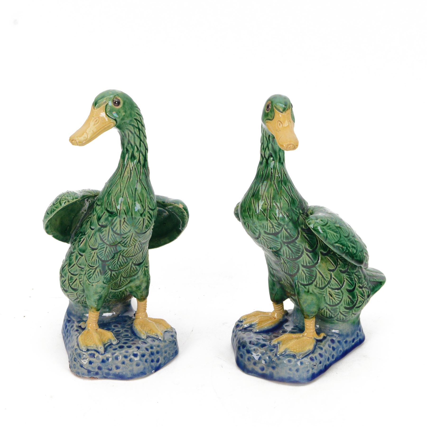 Pair of 20th century Chinese standing ducks, standing on a mottled base, H20cm