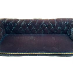 Late 19th century Chesterfield three seat sofa, upholstered in buttoned blue velvet with sprung seat, raised on turned bun feet with castors