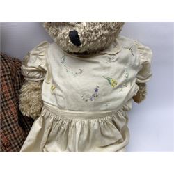 Two early 20th century straw filled jointed teddy bears, first example wearing a tweed jacket bearing Geoffrey Saville label, with leather padded paws and ears, horizontally stitched nose and humpback; second example with applied eyes, vertically stitched nose and faux leather paw pads, both with growler mechanisms, tallest H74cm 