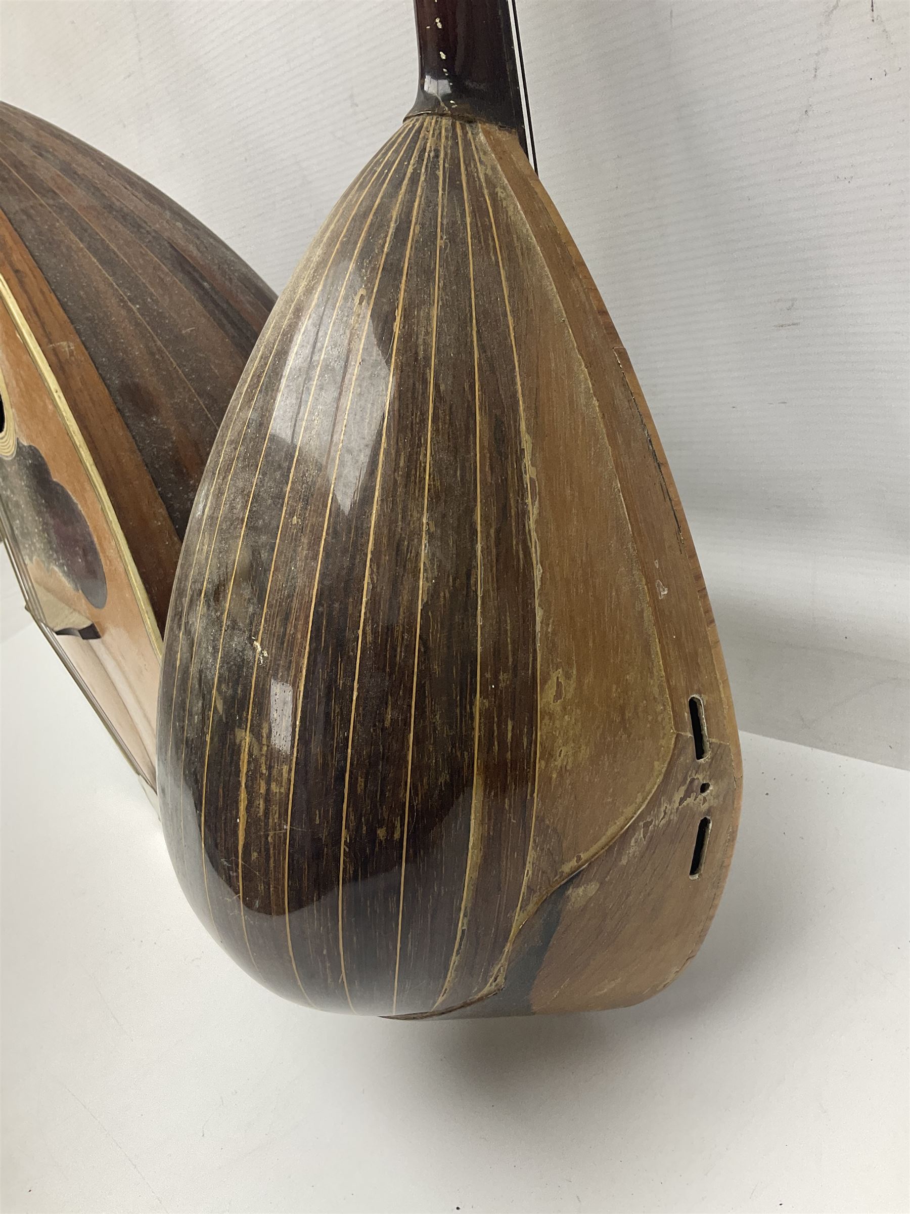 Italian bouzouki type long necked mandolin with segmented lute back and spruce top with tortoiseshell style panels; bears label 'Miroglio & Figli Sicilia Catania Italia' L99cm; and Italian lute back mandolin with segmented back and spruce top bearing label for F. De Mureda Napoli (2)