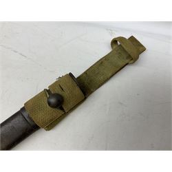 British Pattern 1907 bayonet with 43.5cm fullered steel blade; in leather scabbard with webbing frog L58cm overall; another Pattern 1907 bayonet lacking scabbard; and British Pattern 1888 Mk.I bayonet by Wilkinson London (no scabbard) (3)