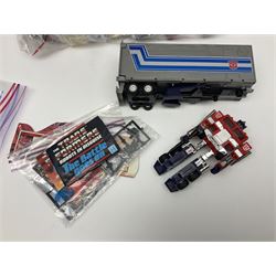 Four 1980sTransformer G1 - Optimus Prime 1984; DinoBot Sludge (Diplodocus) 1984; Cyclonus 1986; and Runamuck 1986; with paperwork; seven Bandai Robo Machines Robots/Transformers; almost fully stocked Panini Sticker album; two annuals; three comics; two posters; and Ladybird story book