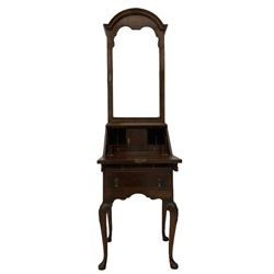 Small early 20th century Queen Anne style bookcase on bureau secretaire, the moulded arched pediment over mirrored door in shaped frame, the bureau fitted with fall front enclosing curved fitted interior, cushion moulded drawer over single drawer, on scroll and shell carved cabriole supports
