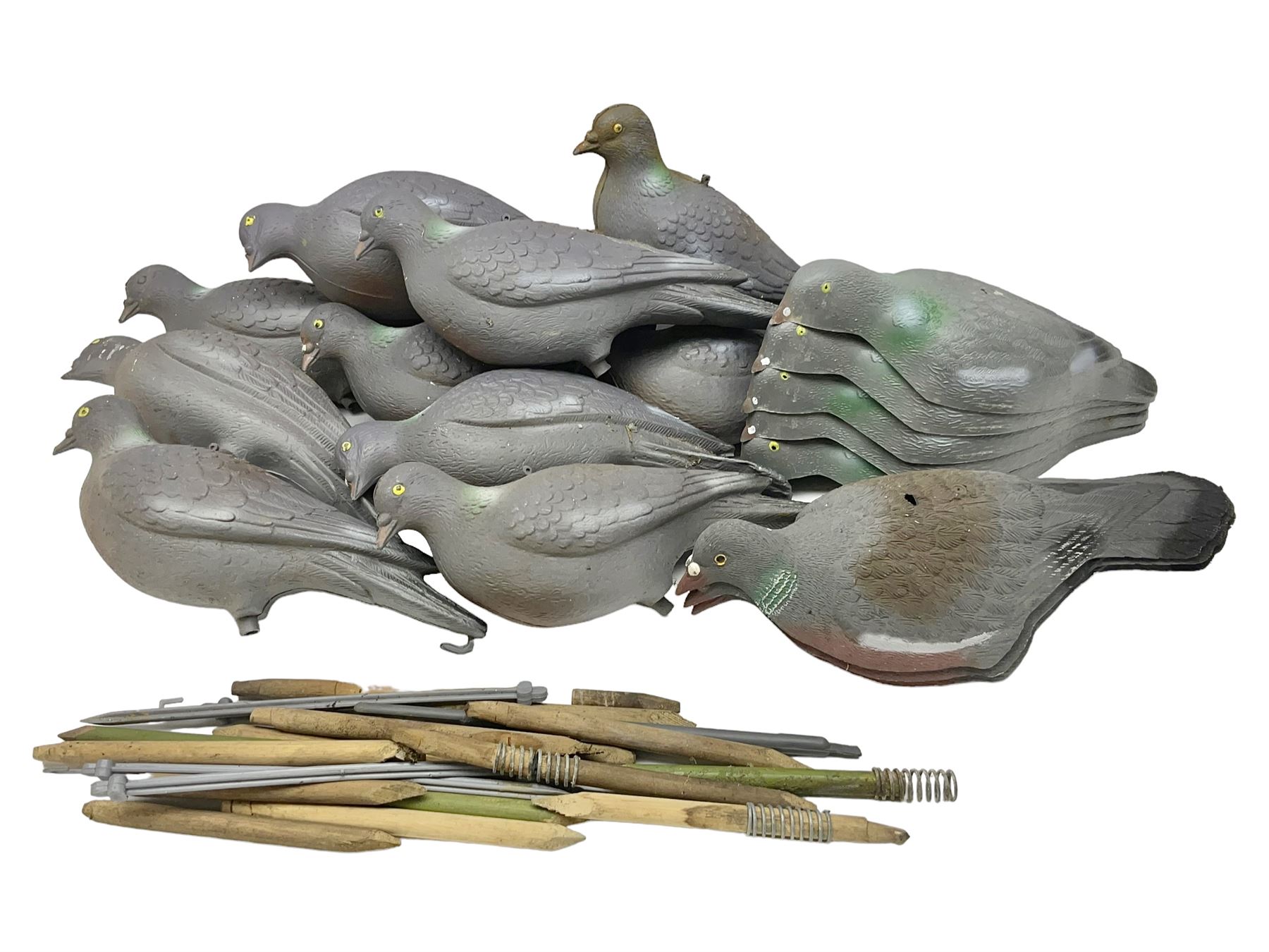 Eighteen plastic pigeon decoys comprising ten full body and eight shells with quantity of various stakes; some marked made in Italy