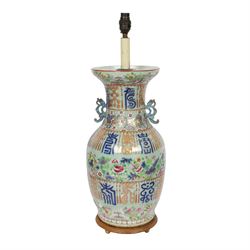 Early 20th century Chinese celadon ground vase, converted to lamp, of baluster form with flared neck and applied twin scroll handles to shoulders, the body decorated with polychrome enamels of birds amongst flowering branches, between bands of archaistic characters in blue, iron red and gilt, including fittings H60cm