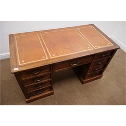  Edwardian mahogany twin pedestal desk, inset tooled leather top, single central frieze drawer flanked by eight graduating drawers, plinth base, W137cm, H72cm, D68cm  