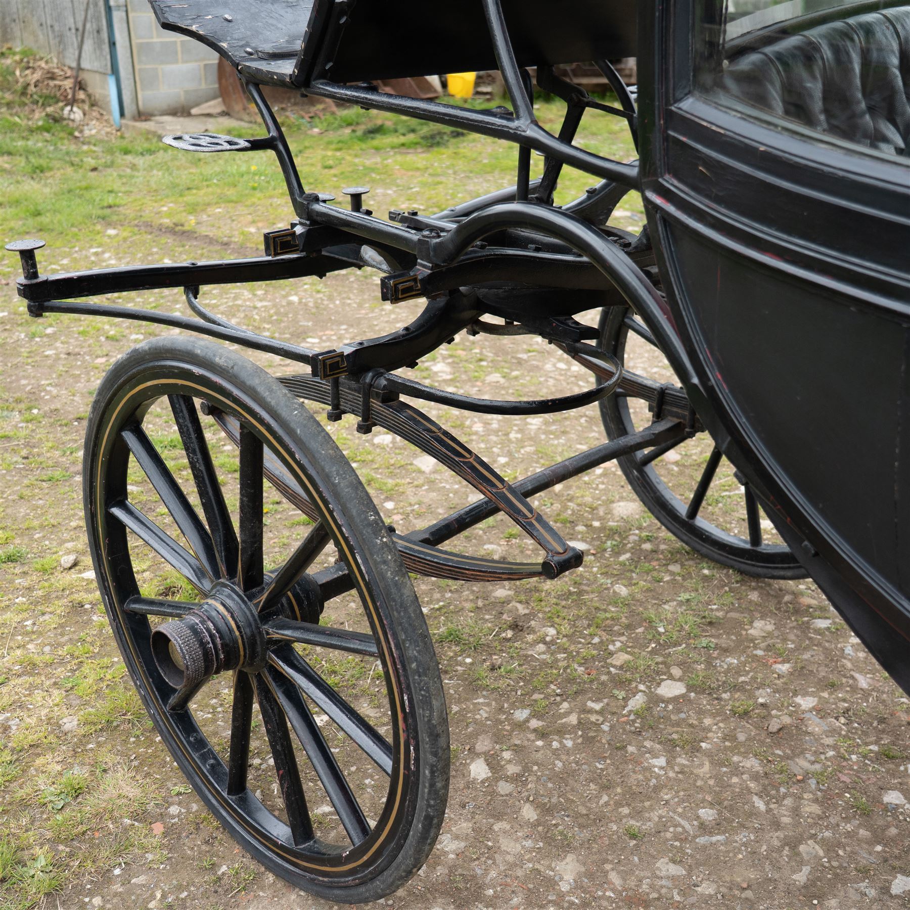 Town Coach by John Marstons Birmingham - Ex Film

A black painted five glass Town Coach by John Marston's Carriage Works Ltd, Birmingham, with enclosed glazed passenger compartment, curved front glass, external coachman's box seat and pole for driving with a pair of horses. The carriage has a timber coach body with buttoned black leather interior, blue upholstered seat cushions, plated exterior door handle, maker plates to the body and step, and John Marston marked hub caps. Mounted on black painted wooden spoked wheels with rubber tyres, leaf spring suspension, underbody turntable steering and iron fittings throughout.
Featured on the film set of 'Victoria' with Jenna Coleman

Features

• Black painted enclosed coach body
• Glazed passenger compartment with five windows
• Curved front glass
• Buttoned black leather interior
• Blue upholstered seat cushions
• External coachman's box seat
• Timber coach body
• Wooden spoked wheels
• Rubber tyres
• Leaf spring suspension
• Underbody turntable steering
• Pole for pair of horses
• Iron foot steps
• Plated exterior door handle
• Maker plates for John Marston's Carriage Works Ltd, Birmingham
• John Marston marked hub caps
• Featured on the film set of Victoria with Jenna Coleman

Dimensions:
Overall length: 390 cm
Width: 190 cm
Height: 214 cm

Wheel Diameters:
Front wheels: 104 cm
Rear wheels: 134 cm

Seating:
Coachman's box: 2
Passenger compartment: 4