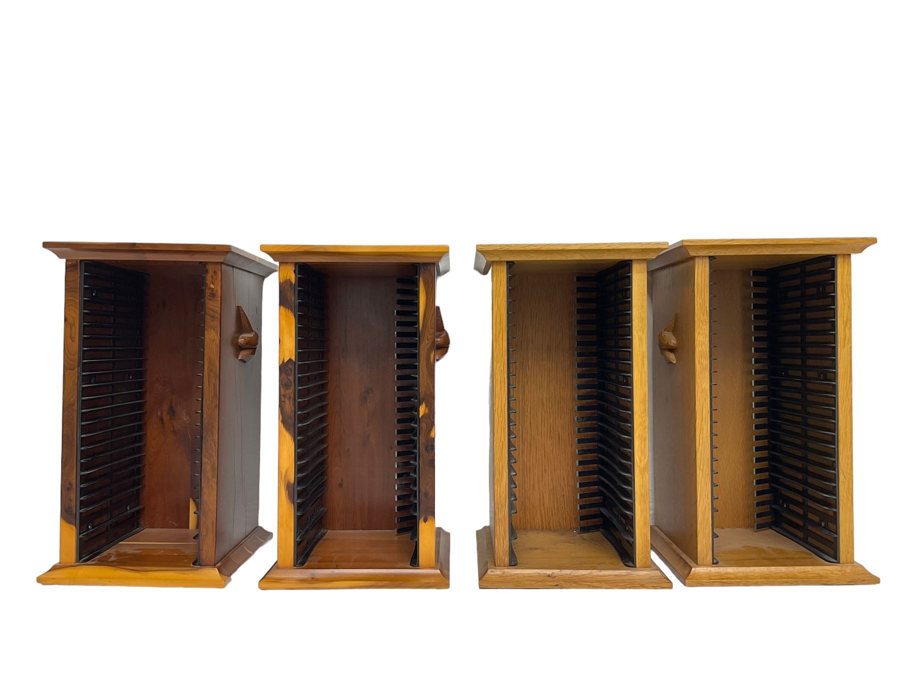 Unicornman - yew wood cabinet, moulded hinged lid over two panelled doors and shelves (W56cm, H99cm, D45cm); and four Unicorn man CD racks two in yew wood and two in oak (W20cm, H36cm, D20cm); all carved with unicorn signature and by Geoff Gell, Coxwold
