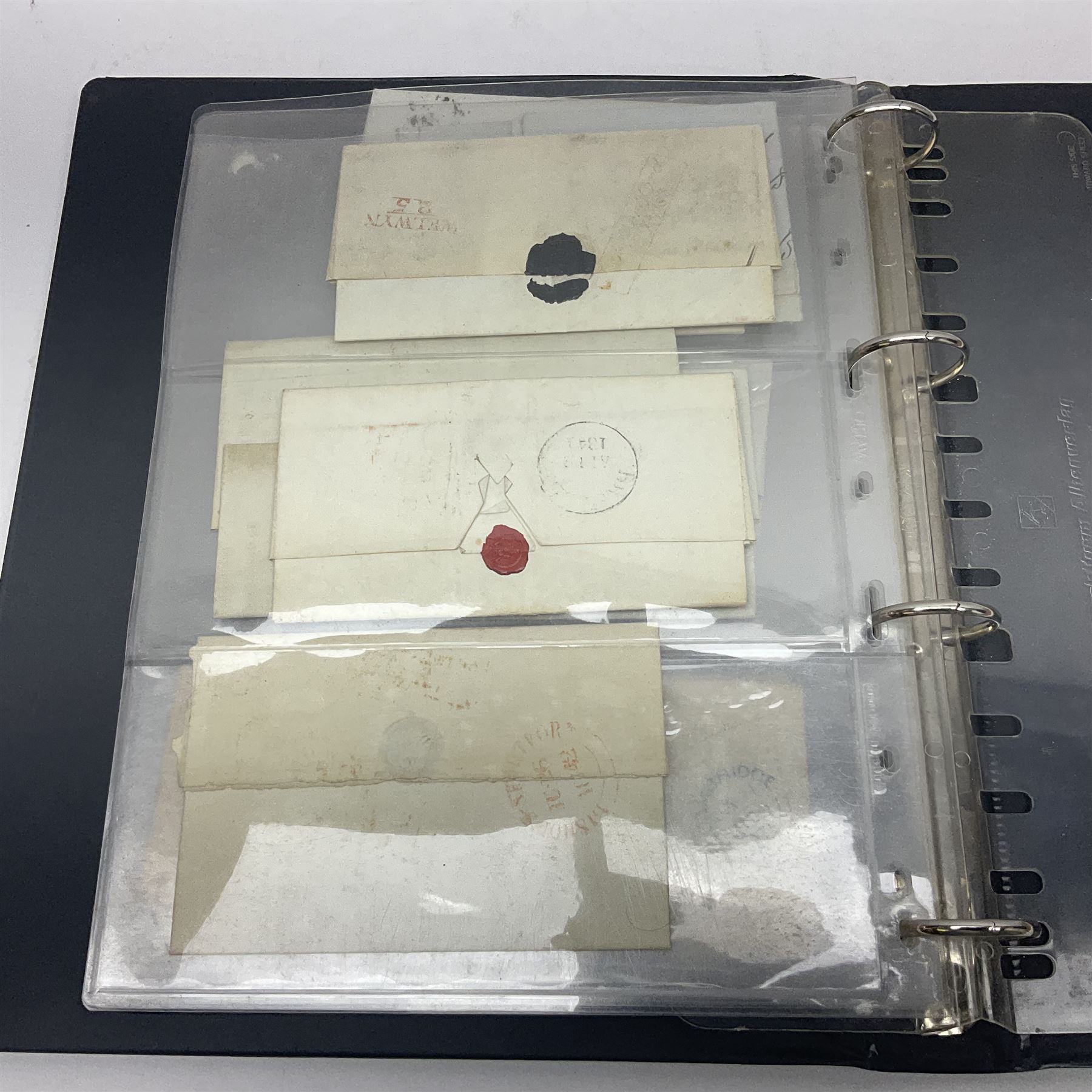Postal history, including pre-stamp, Queen Victoria imperf penny reds on covers or entires a few with black MX cancels, 1841 two pence blue with white lines added on mourning cover, perf penny red on cover etc, housed in a ring binder folder
