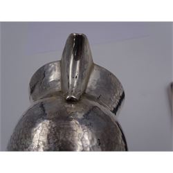 Modern Arts and Crafts style silver jug, of waisted form with fluted rim, with hammered finish throughout, hallmarked John Henry Pank, London 1977, with Hull town mark, H9.8cm